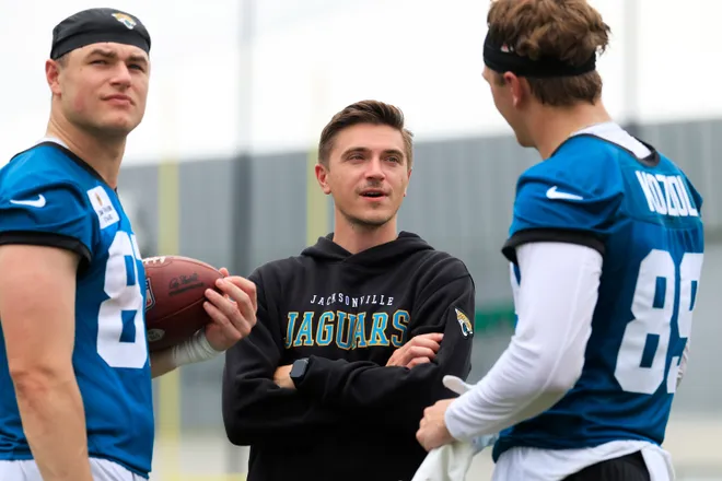 Jacksonville Jaguars general manager James Gladstone, center, talks to tight end Tanner Koziol (89), right, and tight end Nate Boerkircher (87) during rookie minicamp at the Miller Electric Center, Saturday, May 9, 2026 in Jacksonville, Fla. Today was the second of a three day camp concluding Sunday.