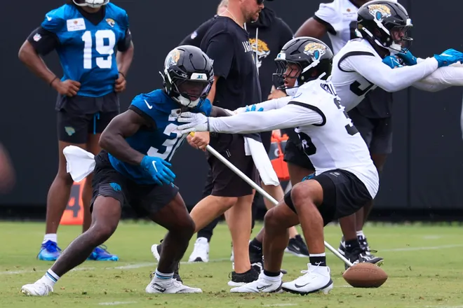 Jacksonville Jaguars running back J'Mari Taylor (30) and safety Devin Neal (36) drill during rookie minicamp at the Miller Electric Center, Saturday, May 9, 2026 in Jacksonville, Fla. Today was the second of a three day camp concluding Sunday.