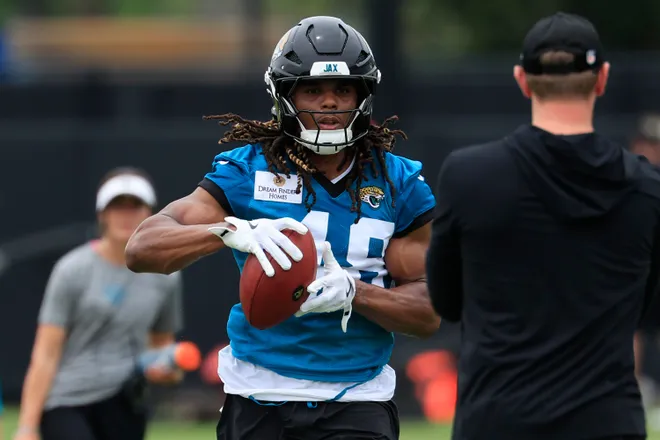 Jacksonville Jaguars tight end Ethan Conner (48) catches a pass from head coach Liam Coen during rookie minicamp at the Miller Electric Center, Saturday, May 9, 2026 in Jacksonville, Fla. Today was the second of a three day camp concluding Sunday.