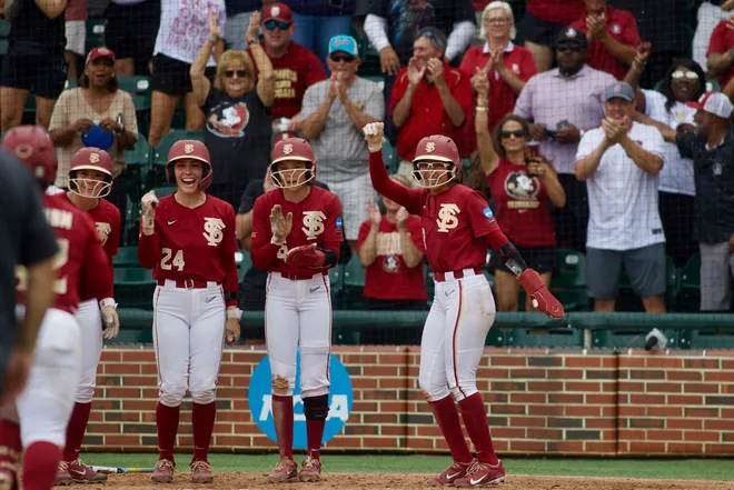 Florida State softball players celebrate a home run against Jacksonville State in the NCAA Tallahassee regional on Saturday, May 16, 2026.