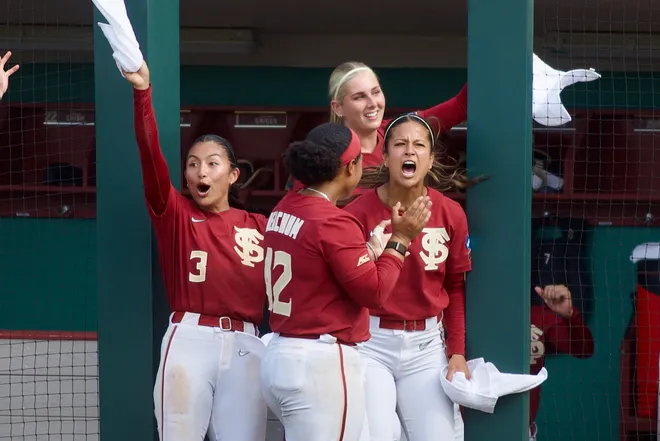 Florida State softball players celebrate a home run against Stetson in the NCAA Tallahassee regional on Saturday, May 16, 2026.
