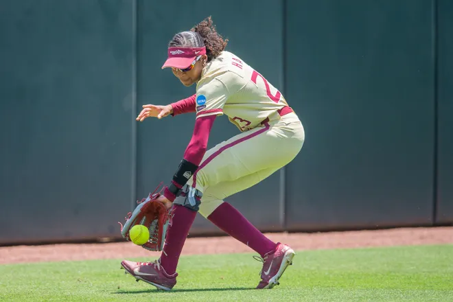 Florida State Seminoles outfielder Kennedy Harp (23) scoops up the ball to throw it in. The Florida State Seminoles defeated the UCF Knights 2-1 on Sunday, May 17, 2026. The teams must play one more game to determine the NCAA Tallahassee regional winner.