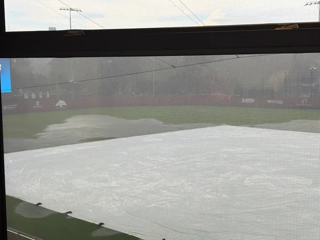 FSU baseball’s Dick Howser Stadium with a tarp on it during a rain delay in the Tallahassee Regional
