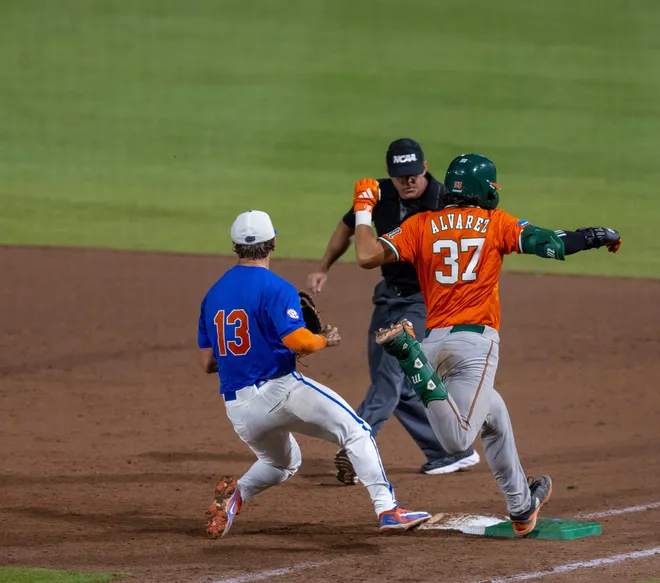 Florida's Landon Stripling (13) beats MiamiÃ•s Alonzo Alvarez (37) to the bag in the sixth in NCAA Gainesville Regionals at Condron Family Ballpark in Gainesville, Florida, Saturday, May 30, 2026. The Gators beat the Hurricanes 22-10. [Cyndi Chambers/ Gainesville Sun] 2026