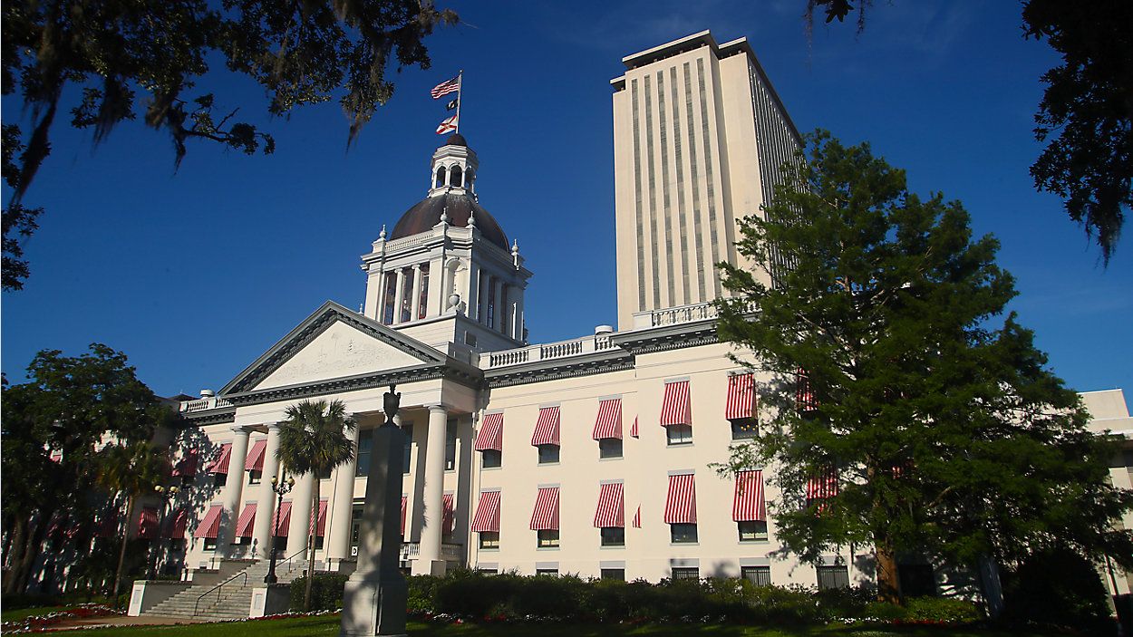 An American flag waves over the Florida Capitol in Tallahassee (AP Photo/Phil Sears, file)