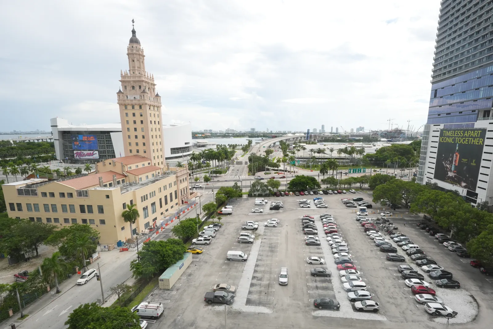 The Miami-Dade College parking lot, the area where Republican Florida Gov. Ron DeSantis is proposing to establish President Donald Trump's presidential library, is seen next to the Freedom Tower, left, on Sept. 23, 2025, in Miami. (AP Photo/Marta Lavandier, File)