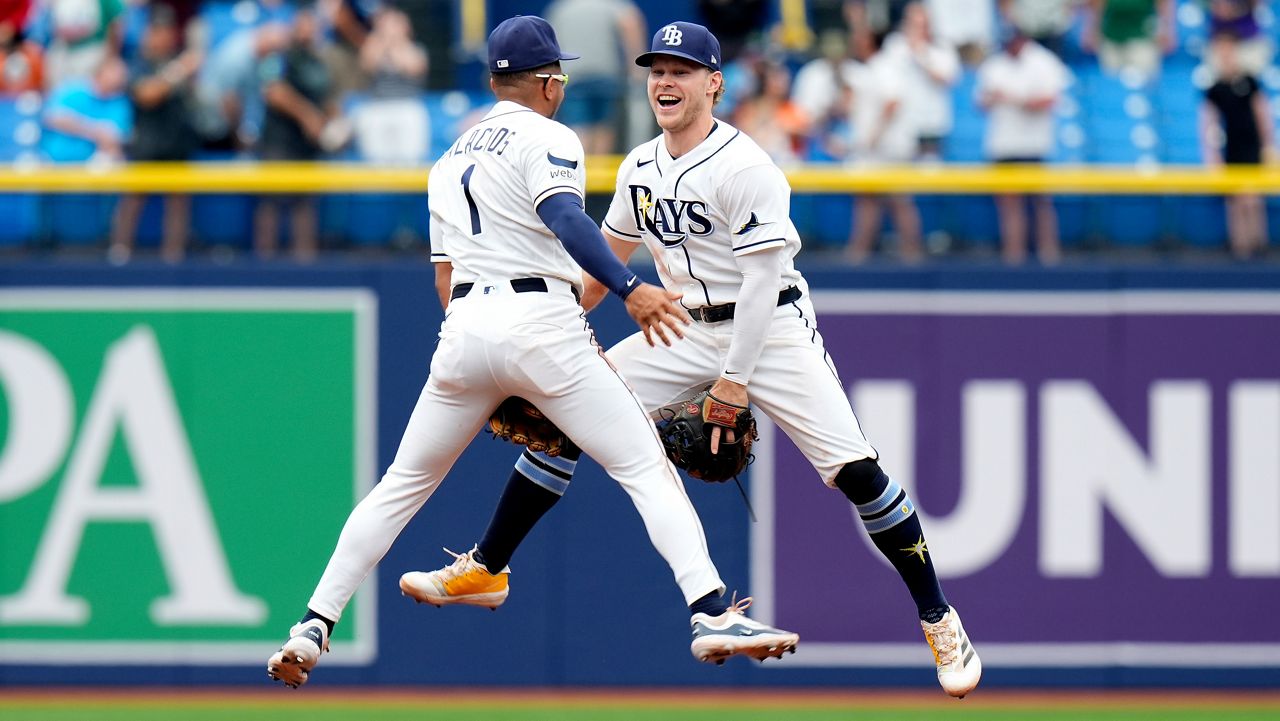 Tampa Bay Rays second baseman Richie Palacios (1) and shortstop Taylor Walls celebrate after the team defeated the Baltimore Orioles during a baseball game Wednesday, May 20, 2026, in St. Petersburg, Fla. (AP Photo/Chris O'Meara)