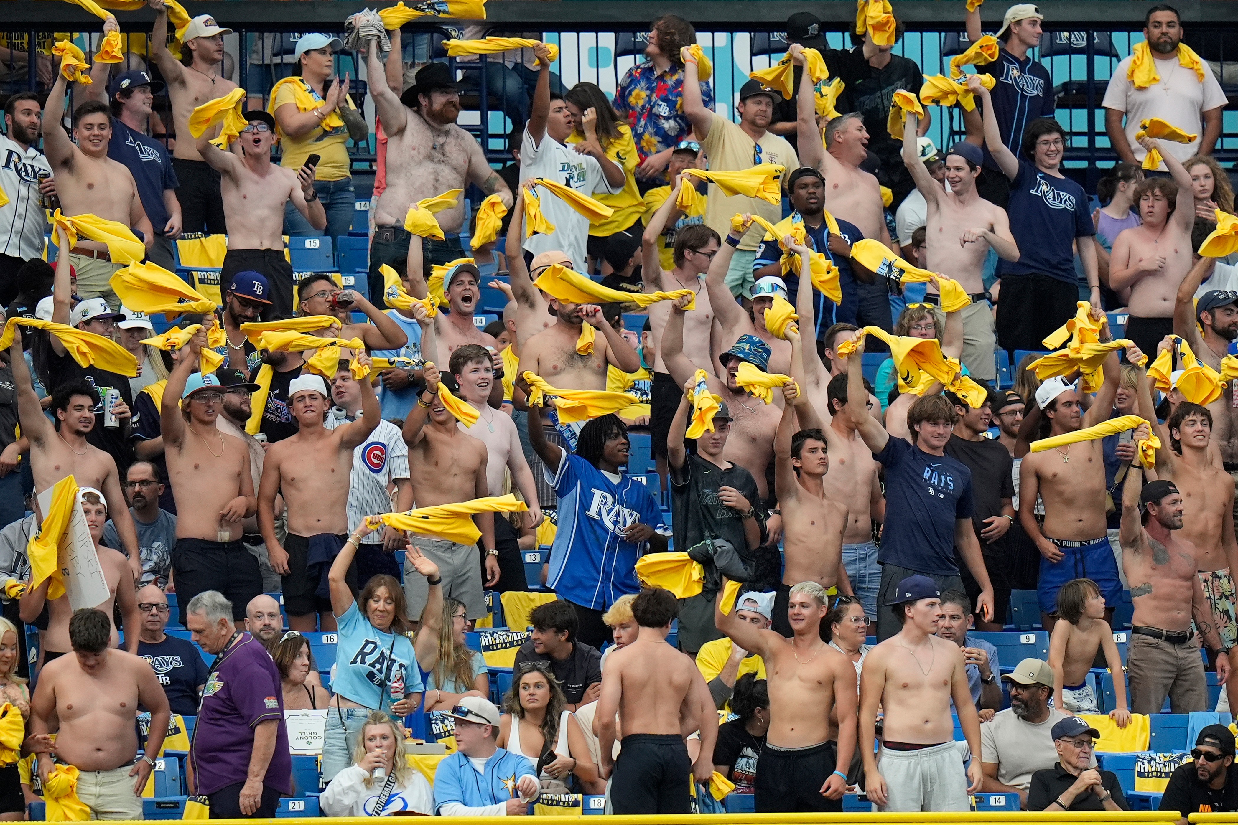 Fans in the “Tarp Off” section of the stadium wave...