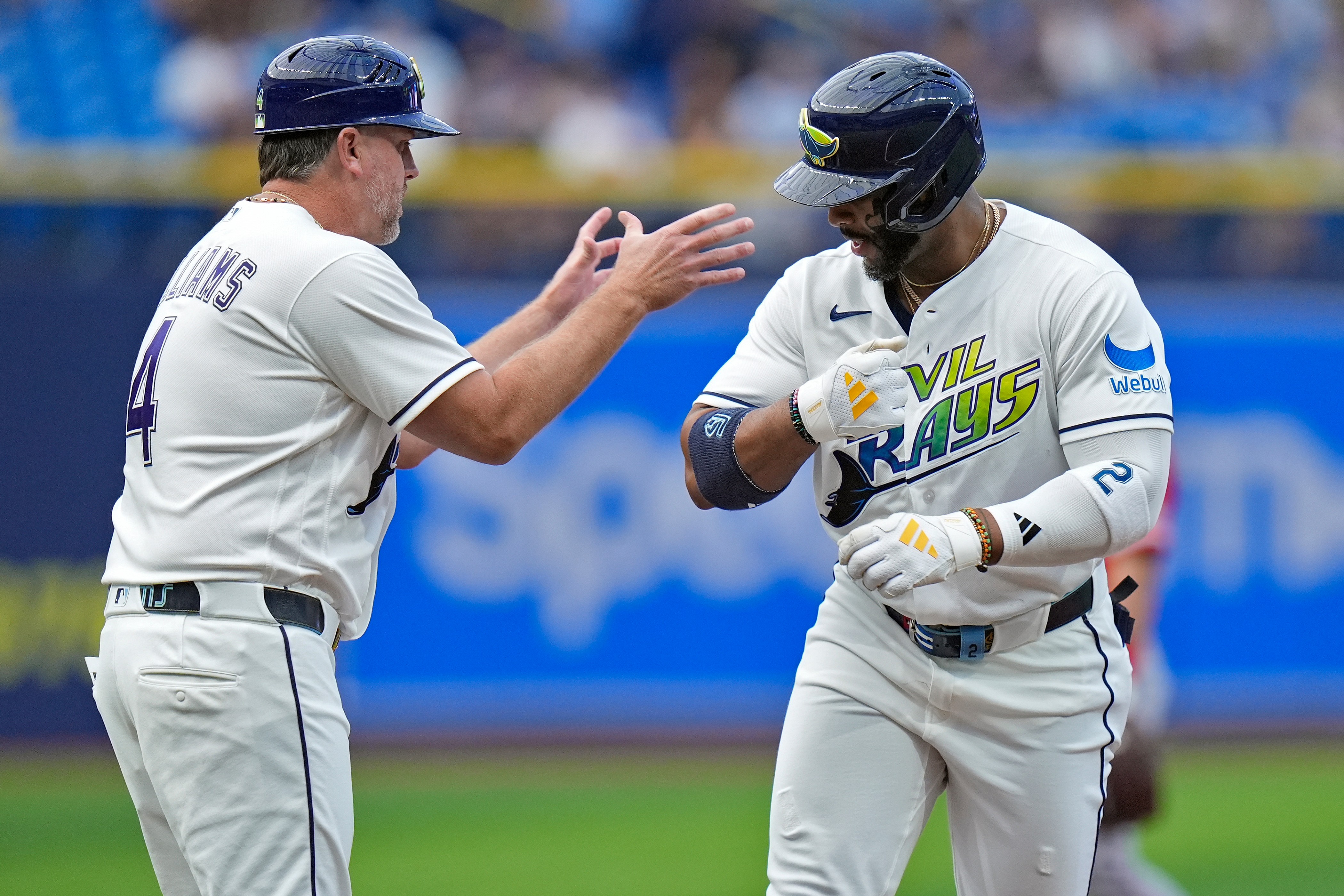The Tampa Bay Rays’ Yandy DÃaz, right, celebrates with third...