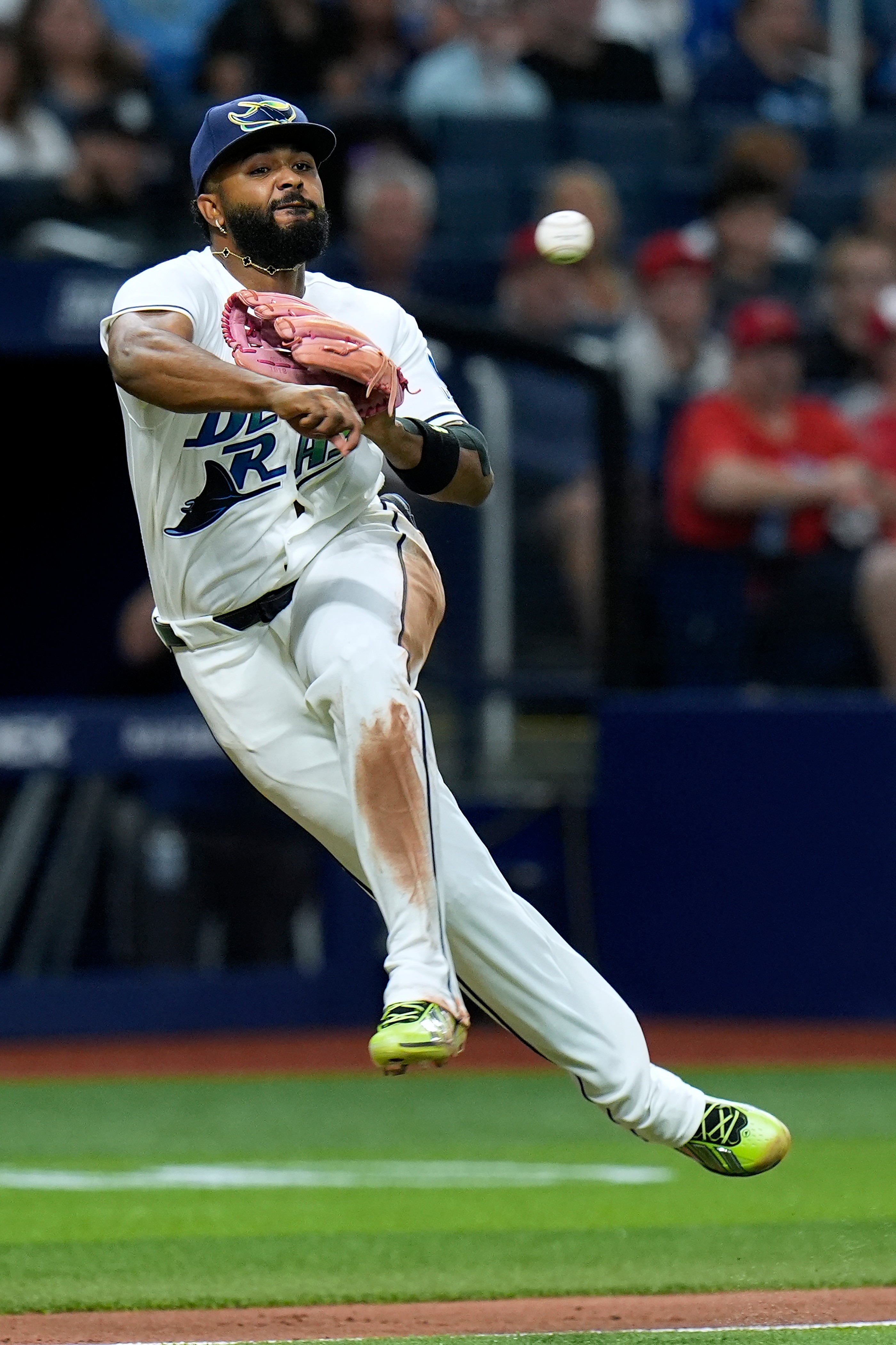 Tampa Bay Rays third baseman Junior Caminero throws the ball...