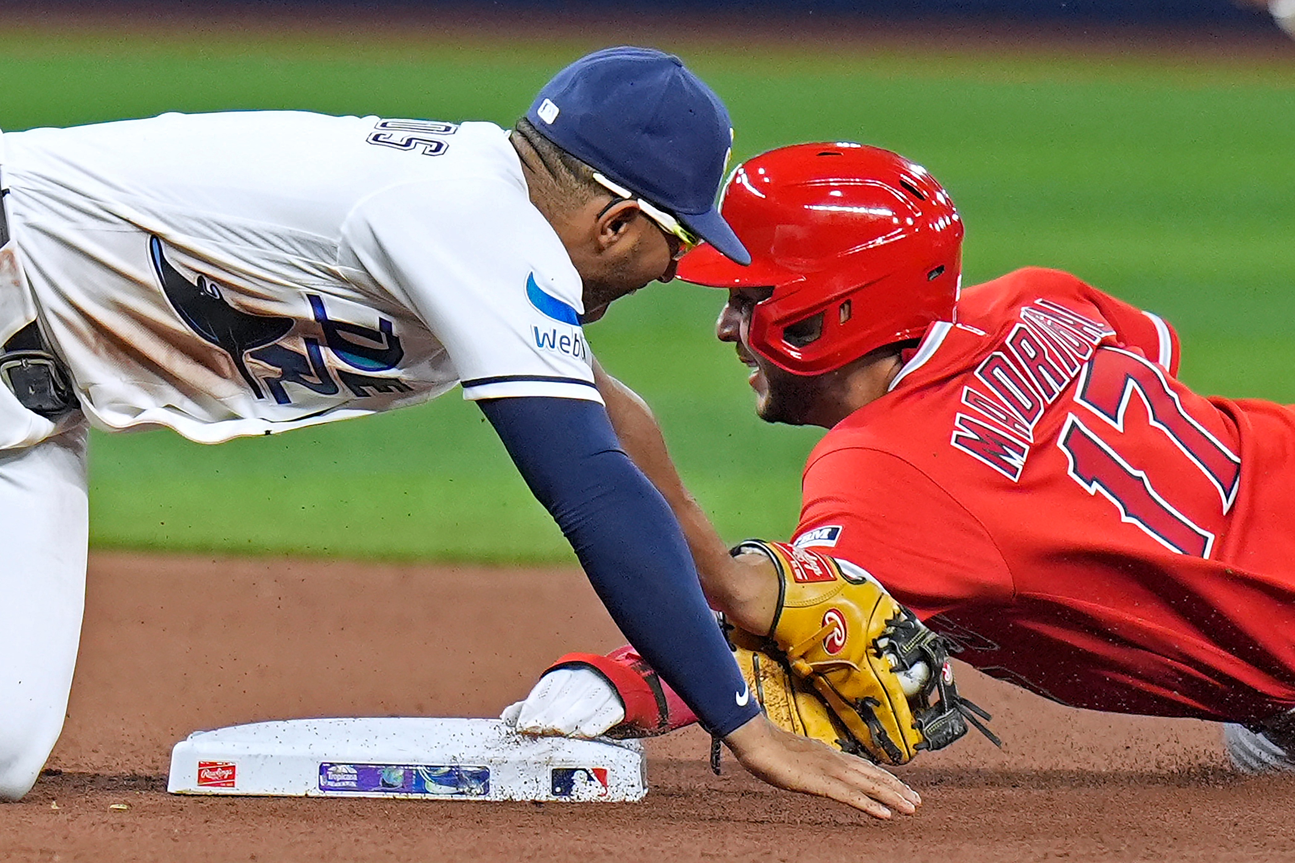 Tampa Bay Rays second baseman Richie Palacios, left, tags out...