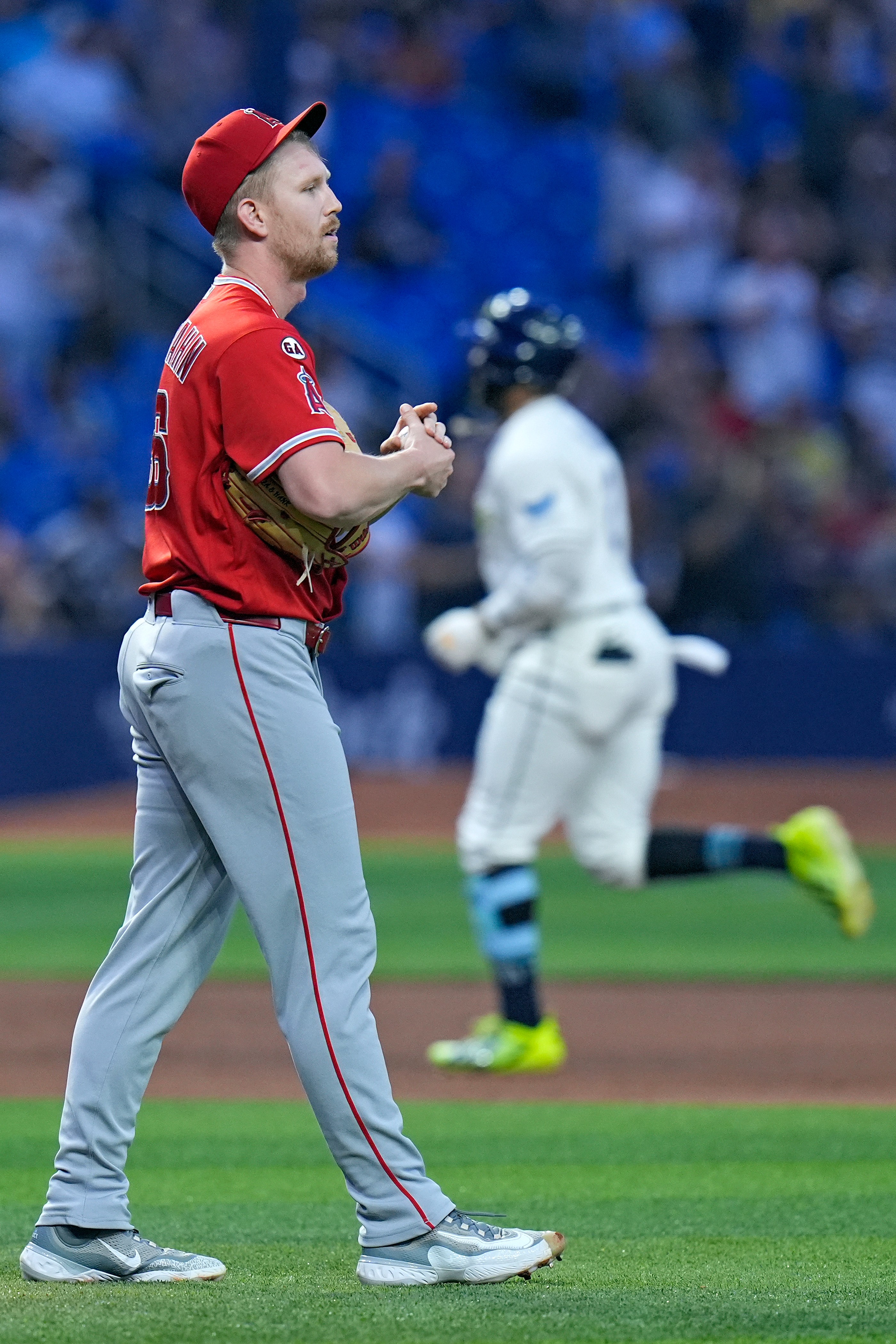 Angels relief pitcher Ryan Zeferjahn, left, reacts as the Tampa...