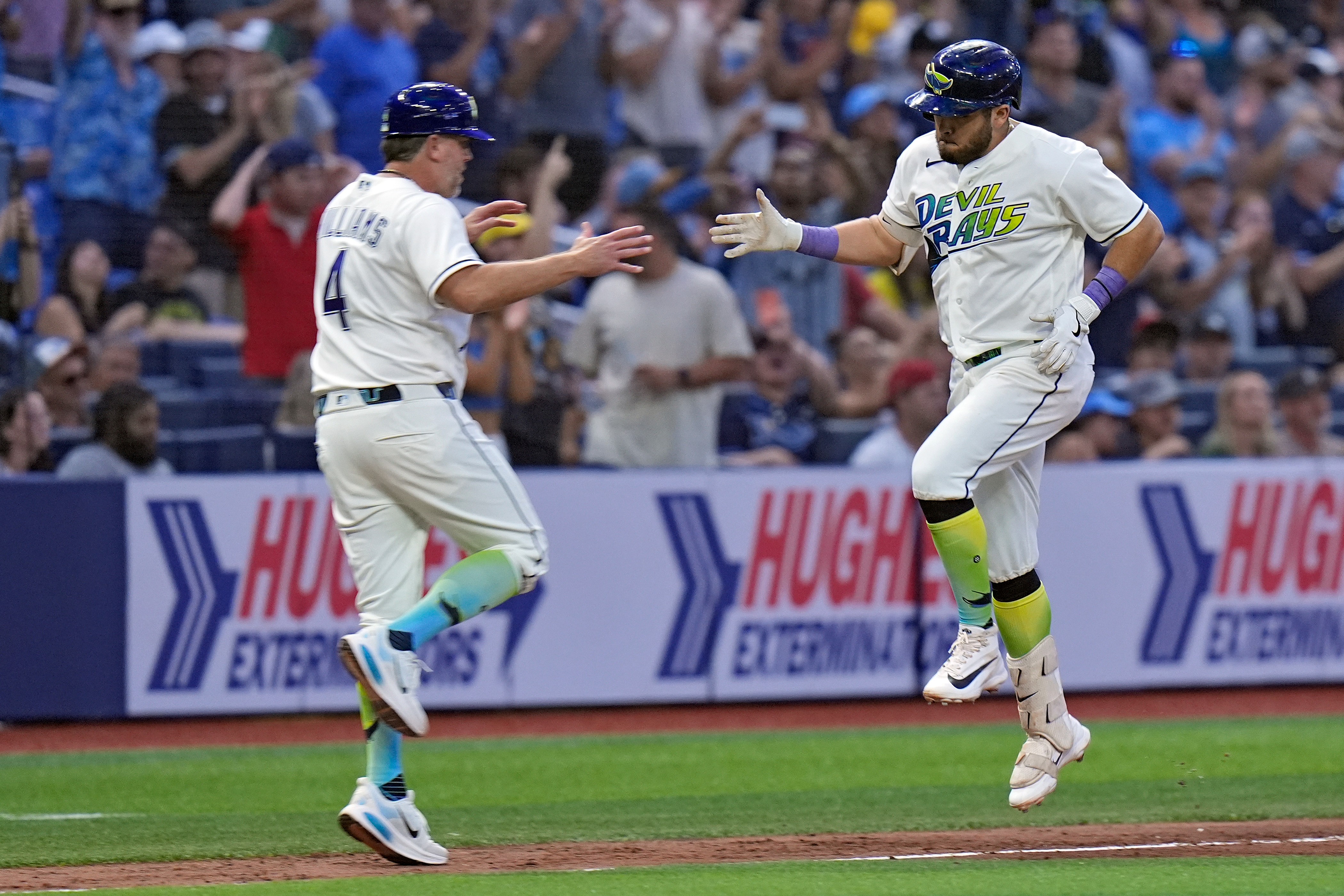 The Tampa Bay Rays’ Jonathan Aranda, right, celebrates with third...