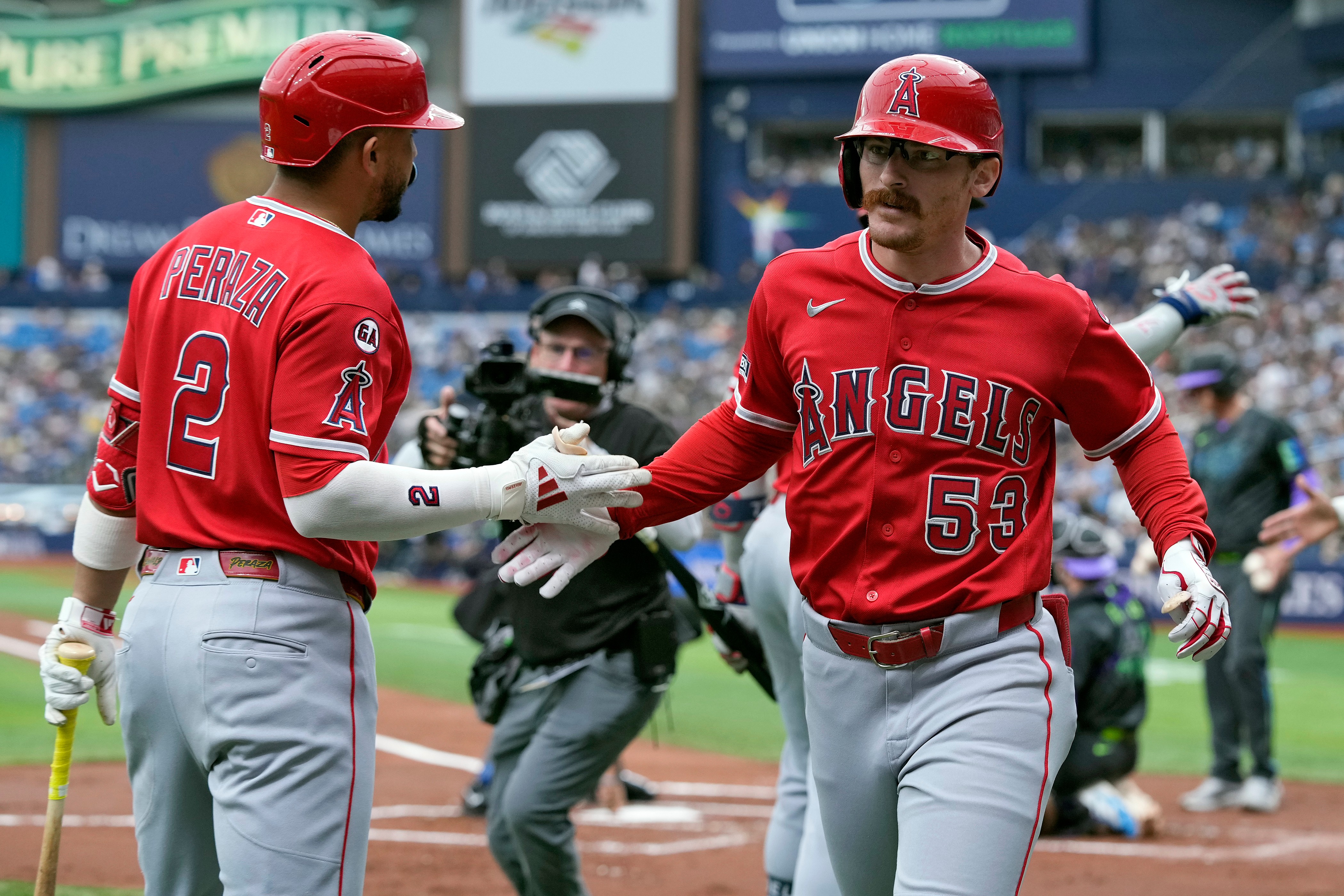 Angels’ Wade Meckler (53) celebrates his grand slam off Tampa...