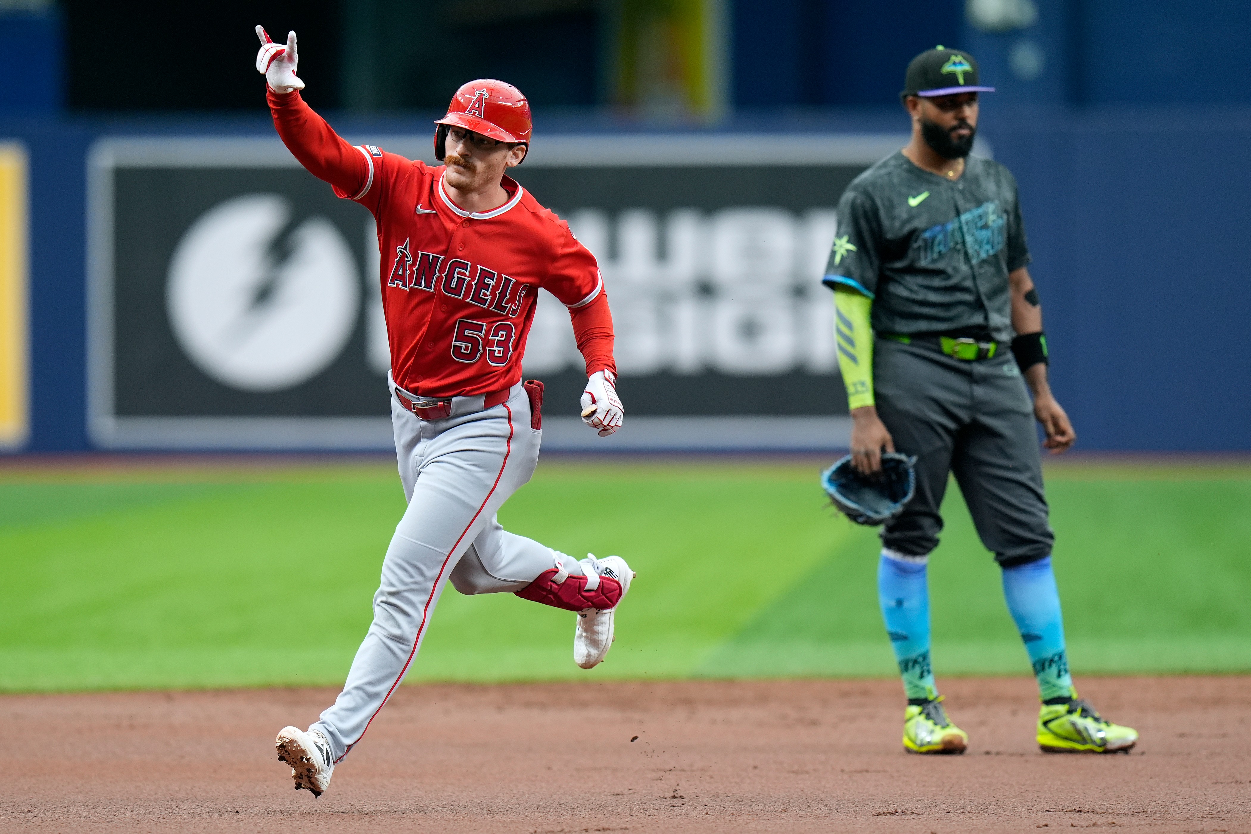 Angels’ Wade Meckler (53) reacts after his grand slam off...