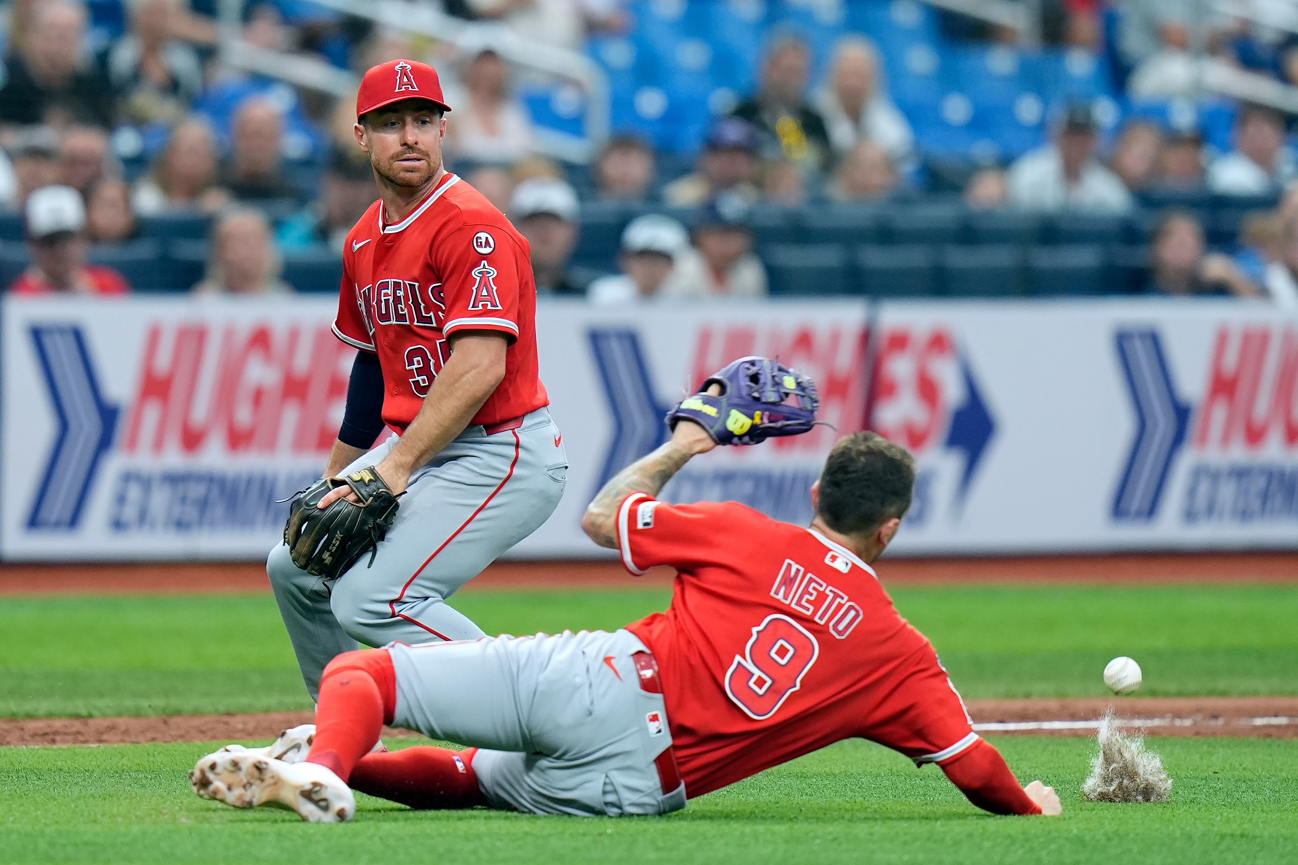 Angels shortstop Zach Neto (9) overruns a pop fly double...