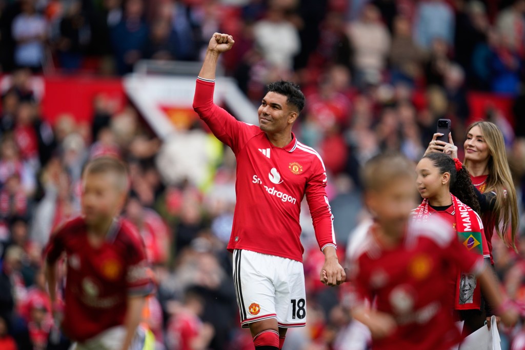 Accompanied by his family Manchester United's Casemiro greets fans after his last game for the club at the end of English Premier League soccer match between Manchester United and Nottingham Forest in Manchester, England, Sunday, May 17, 2026.