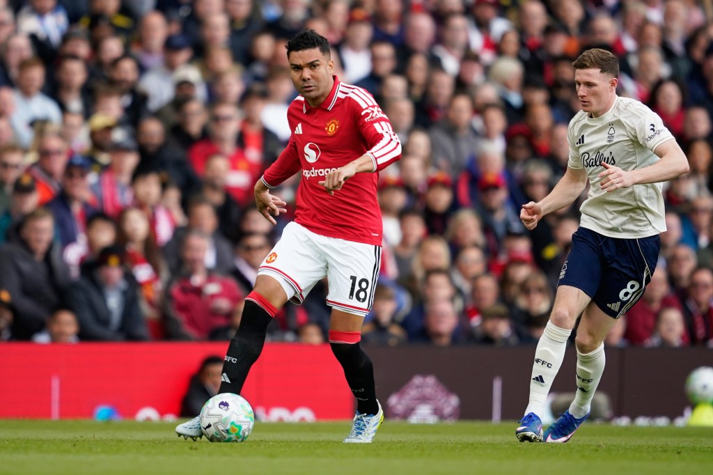 Manchester United's Casemiro, centre, and Nottingham Forest's Elliot Anderson in action during the English Premier League soccer match between Manchester United and Nottingham Forest in Manchester, England, Sunday, May 17, 2026.