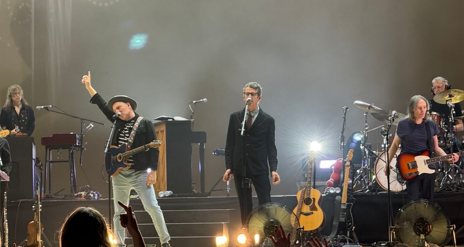 Photo of Belle and Sebastian performing on stage in Miami.