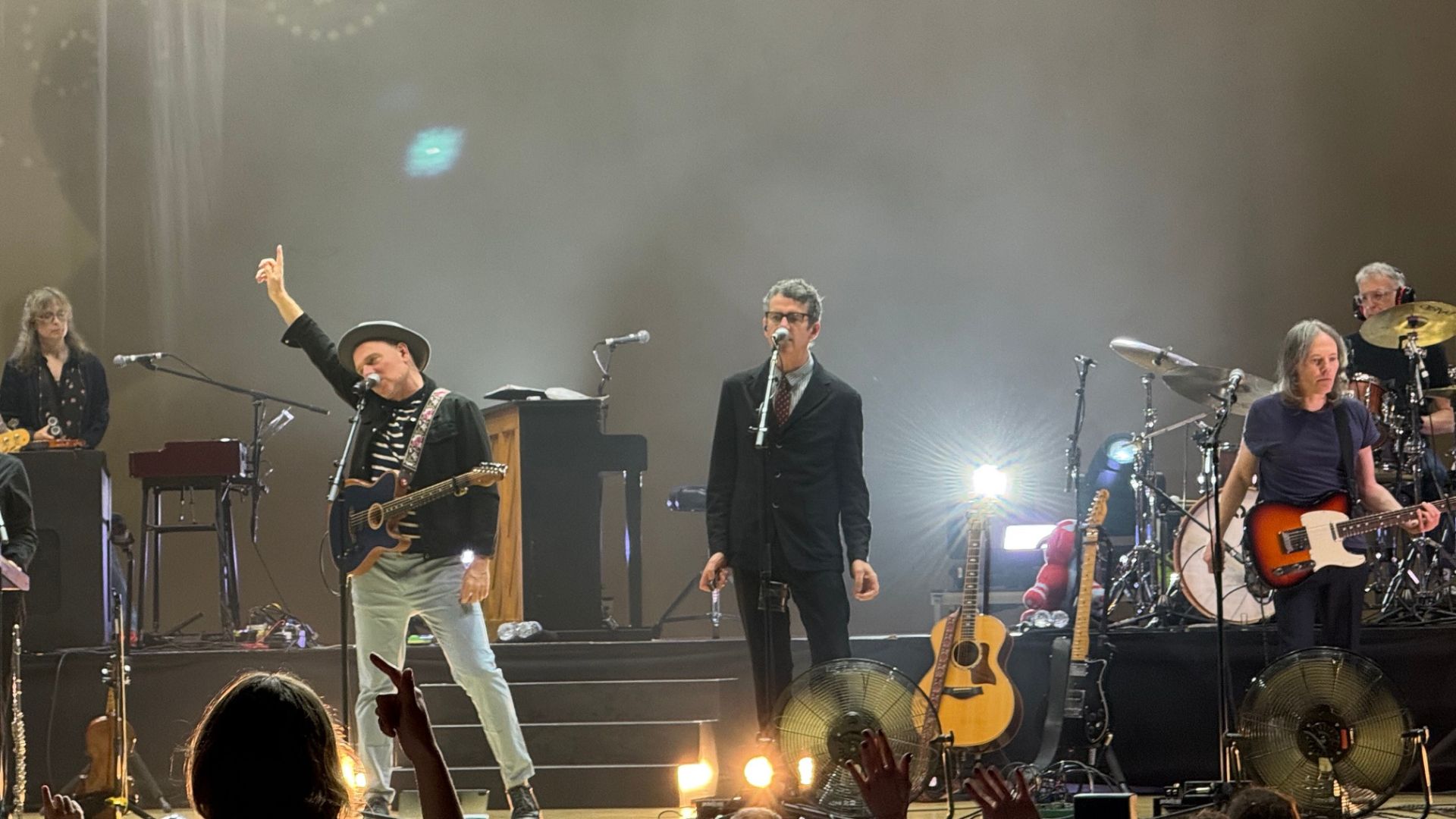Photo of Belle and Sebastian performing on stage in Miami.