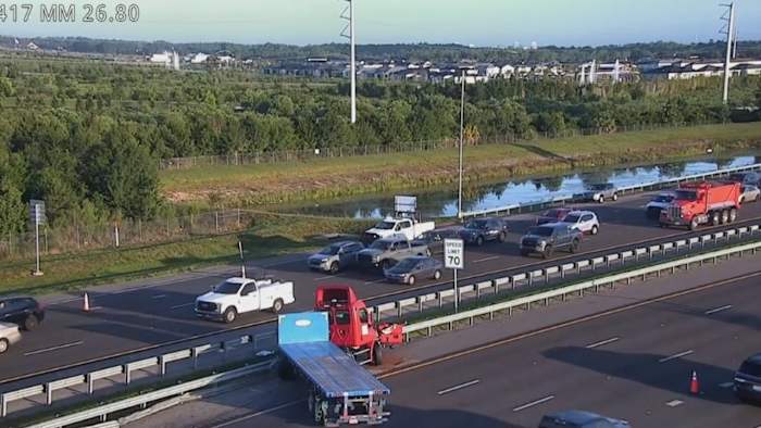 Semi-truck strikes guardrail, scatters debris across SR-417 in Orange County, troopers say