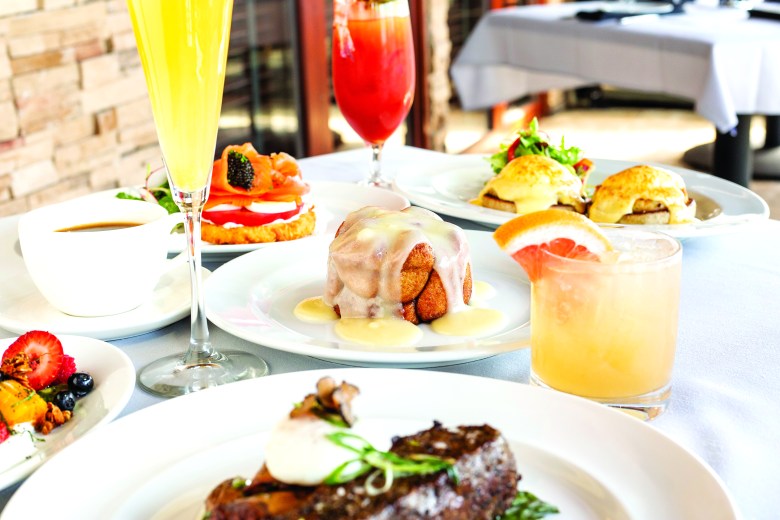 A Mother's Day Brunch spread at Ocean Prime, featuring mimosa, Bloody Mary's, steak, eggs Benedict, french toast, caviar and coffee
