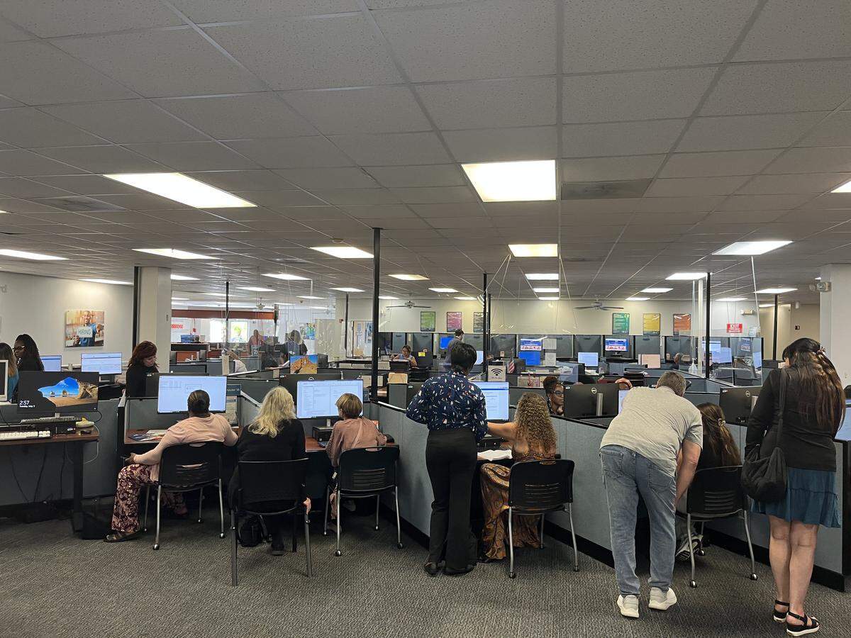 Jobseekers work on documents at CareerSource Broward’s Hollywood office.