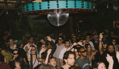 Photo of a crowd dancing under a disco ball in Miami.