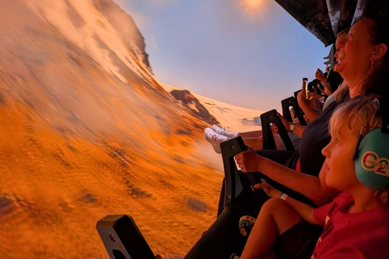 mother and son enjoy Expedition Odyssey Fire & Ice ride scene