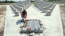 Robin Steinbrenner takes a moment to pay her respects Wednesday, May 11, 2011 at the memorial in Miami-Dade County, Florida, to those who died in the ValuJet Flight 592 crash. Robin's father Fred Steinbrenner was on that flight that crashed into the Everglades 15 years ago. (Peter Andrew Bosch/Miami Herald/Tribune News Service via Getty Images)