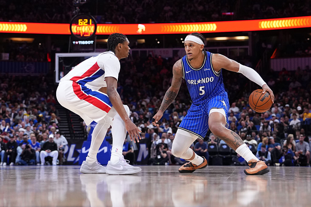 ORLANDO, FLORIDA - APRIL 06: Paolo Banchero #5 of the Orlando Magic dribbles the ball against Ausar Thompson #9 of the Detroit Pistons during the fourth quarter at Kia Center on April 06, 2026 in Orlando, Florida. NOTE TO USER: User expressly acknowledges and agrees that, by downloading and or using this photograph, User is consenting to the terms and conditions of the Getty Images License Agreement. (Photo by Rich Storry/Getty Images)