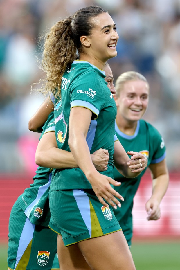 Eva Gaetino #23 of the Denver Summit FC celebrates with Kaleigh Kurtz #3 after scoring a goal against the Orlando Pride in the first half at Dick's Sporting Goods Park on May 16, 2026 in Commerce City, Colorado. (Matthew Stockman, Getty Images)