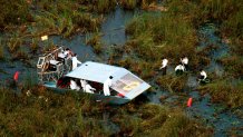 Search And Rescue Workers Reach Into The Muck As They Search For Evidence In The Crash Of Valujet Flight #592. 5/14/96 (Photo By Miami Herald/Getty Images)