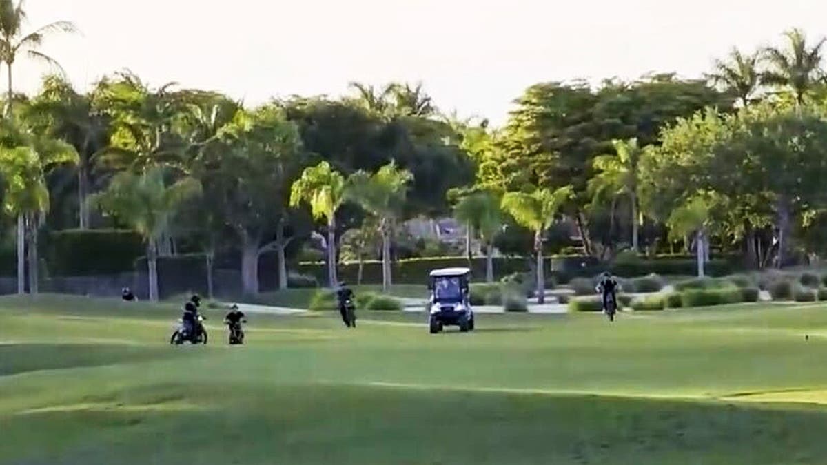 Group of teens on Florida golf course.