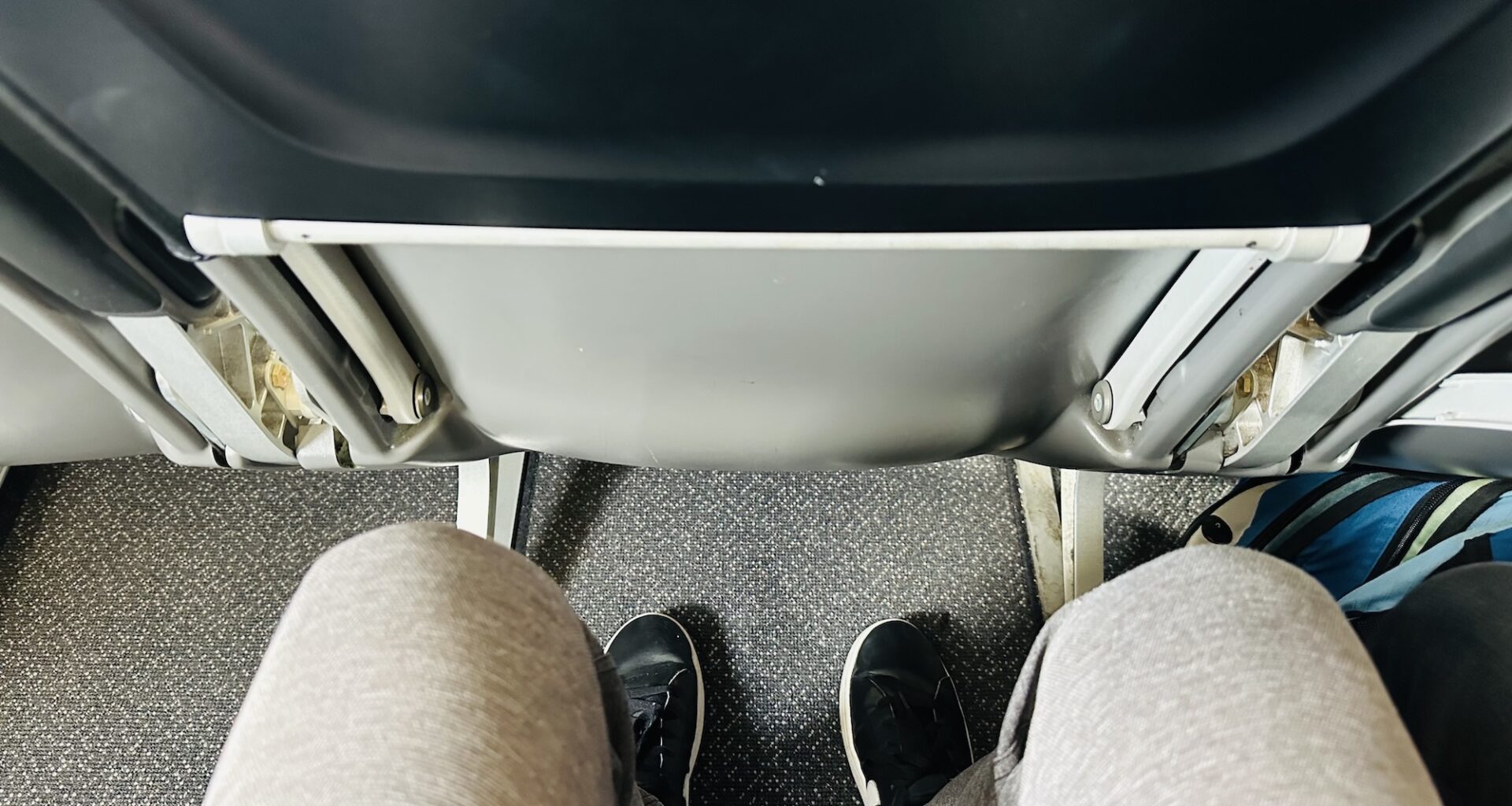 photo of a person's legroom on a plane
