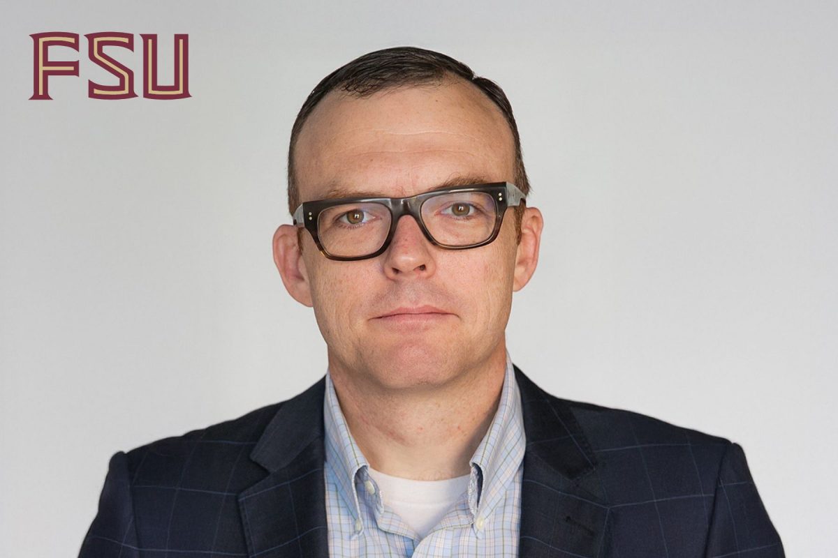 Headshot of the new FSU Dean of The Graduate School, Gregory Bell, wearing glasses in a suit jacket.