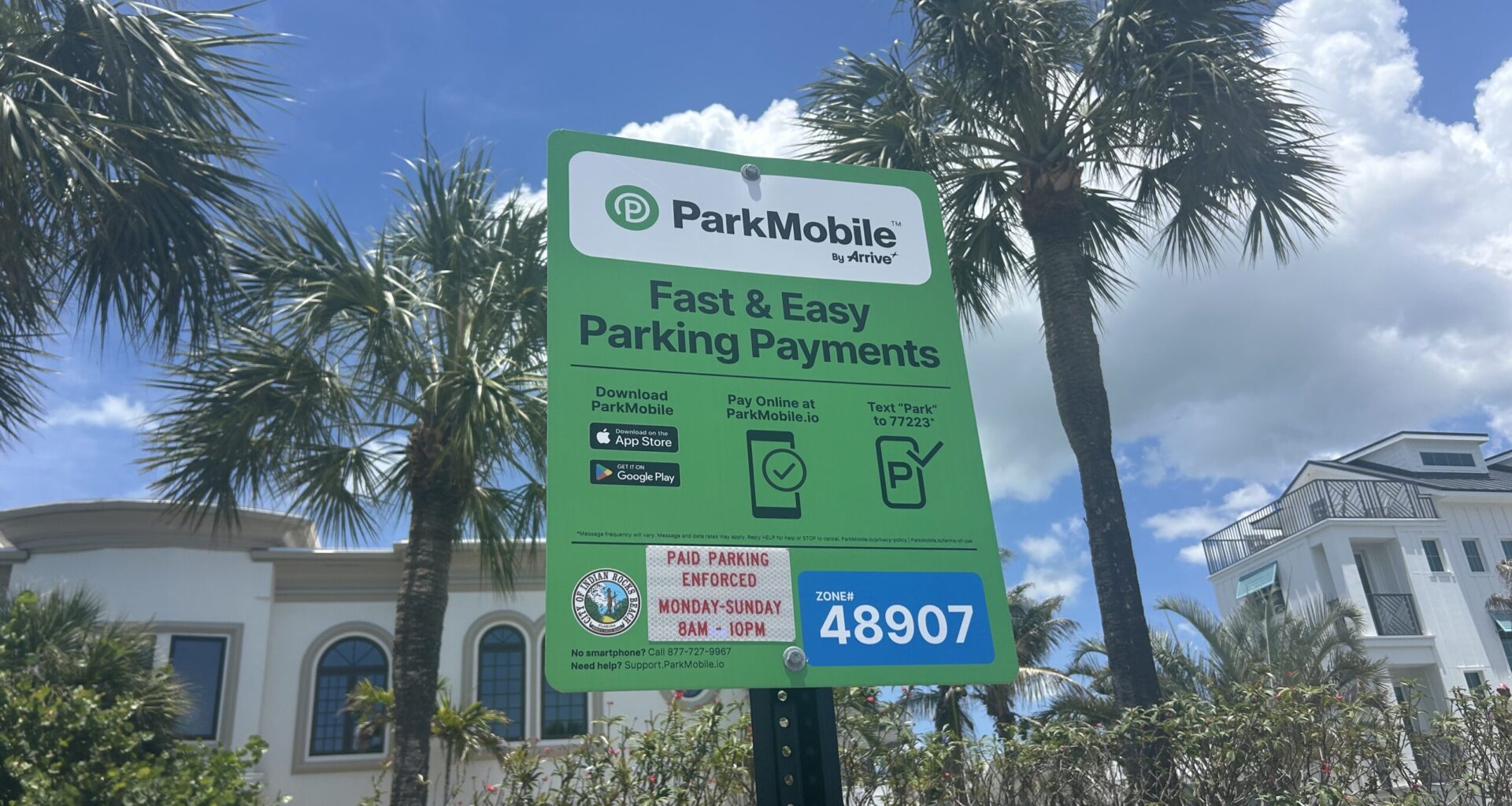 This is a picture of a ParkMobile sign at Indian Rocks Beach for visitors to pay to park.