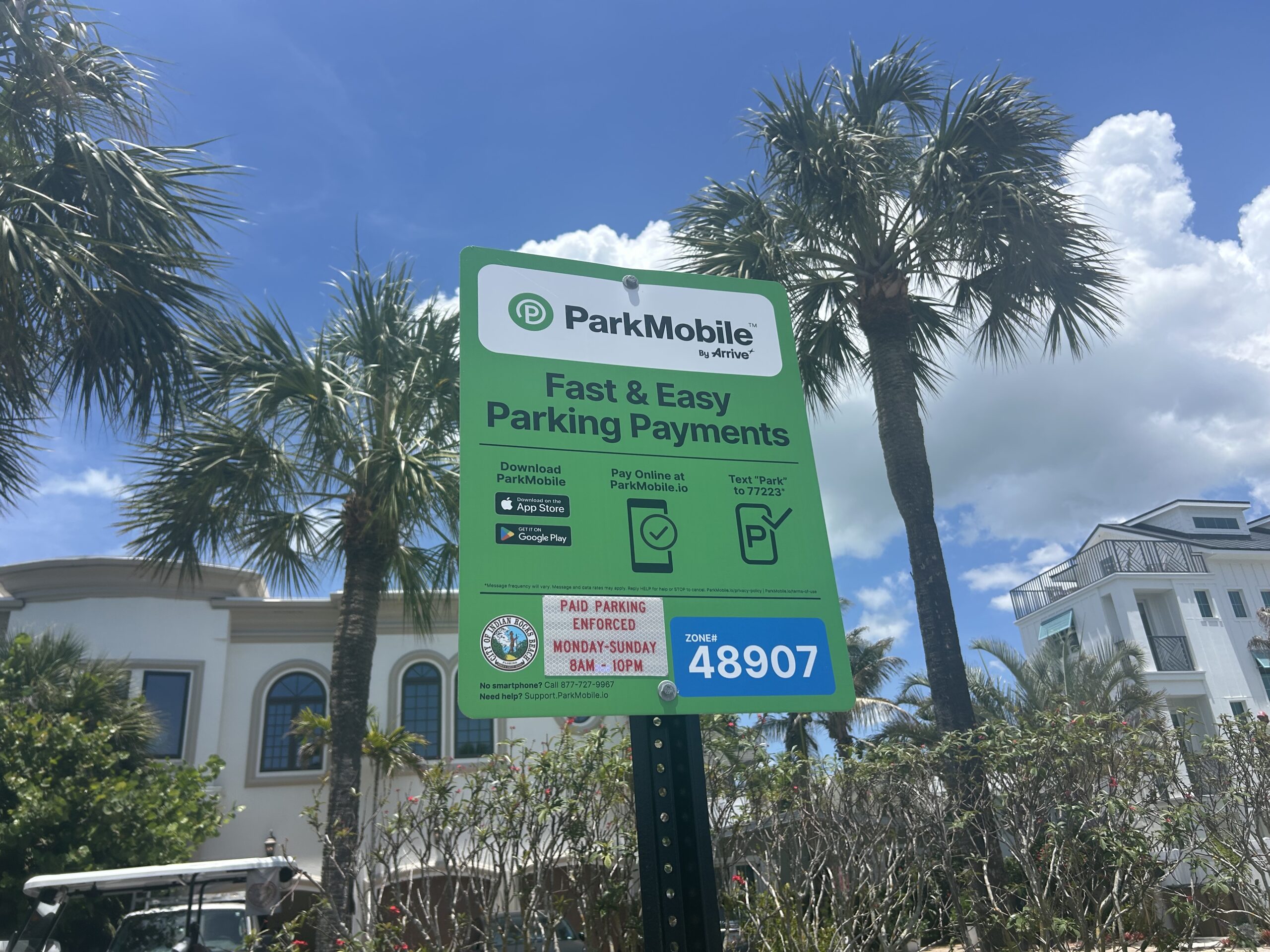 This is a picture of a ParkMobile sign at Indian Rocks Beach for visitors to pay to park.
