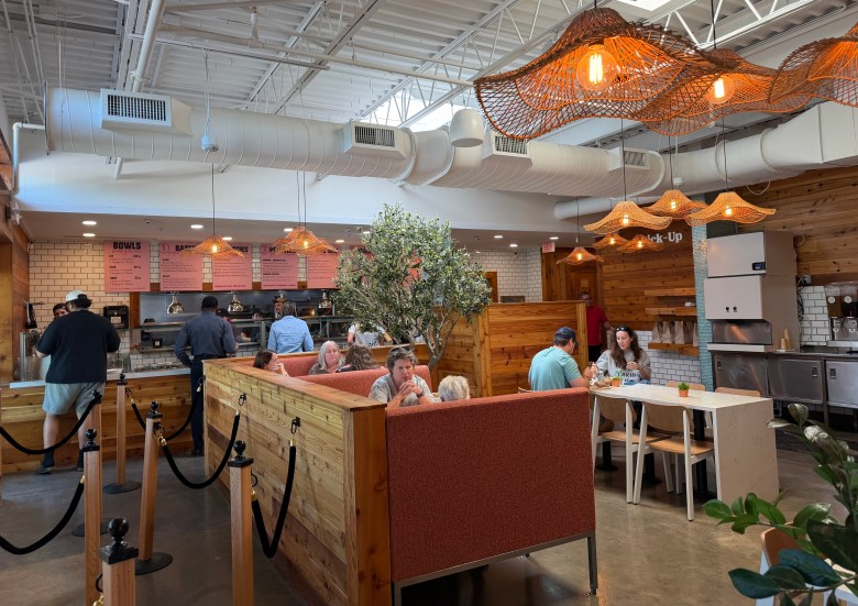 Interior of Fresh Kitchen in St. Petersburg with new wood and salmon colored accents.