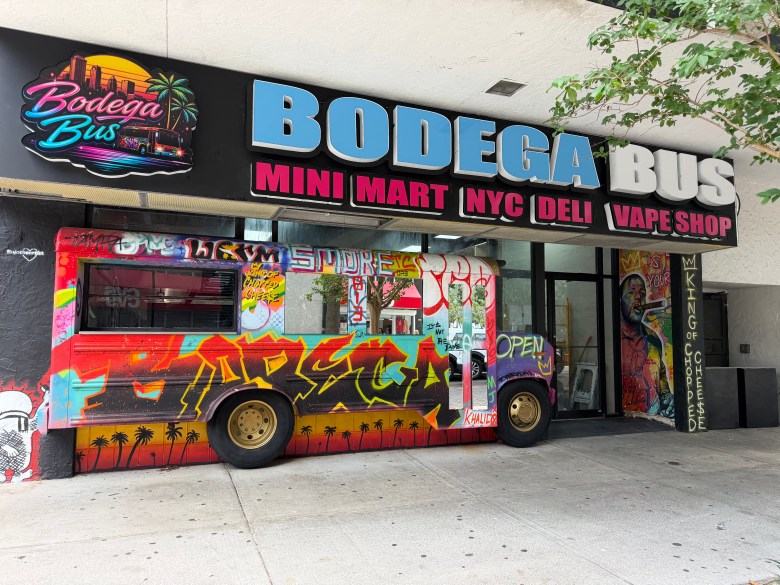 Front of Bodega Bus featuring a gratified school bus to-go window and the words "Mini Mart," "NYC Deli" and "Vape Shop"