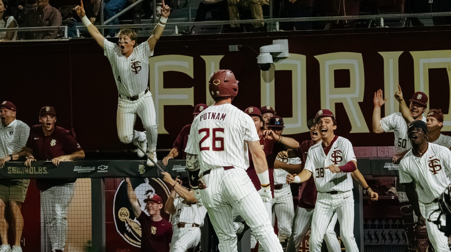 Eli Putnam looks at a jubilant Florida State dugout after tying Thursday's game with Miami on a home run in the bottom of the ninth inning. (Courtesy of FSU Sports Information)
