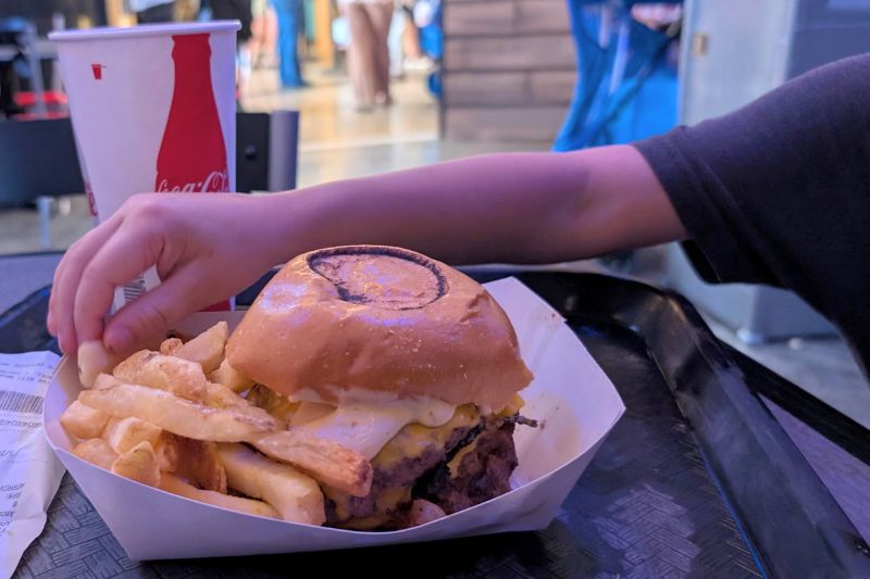 Jaws-themed burger in basket with fries.