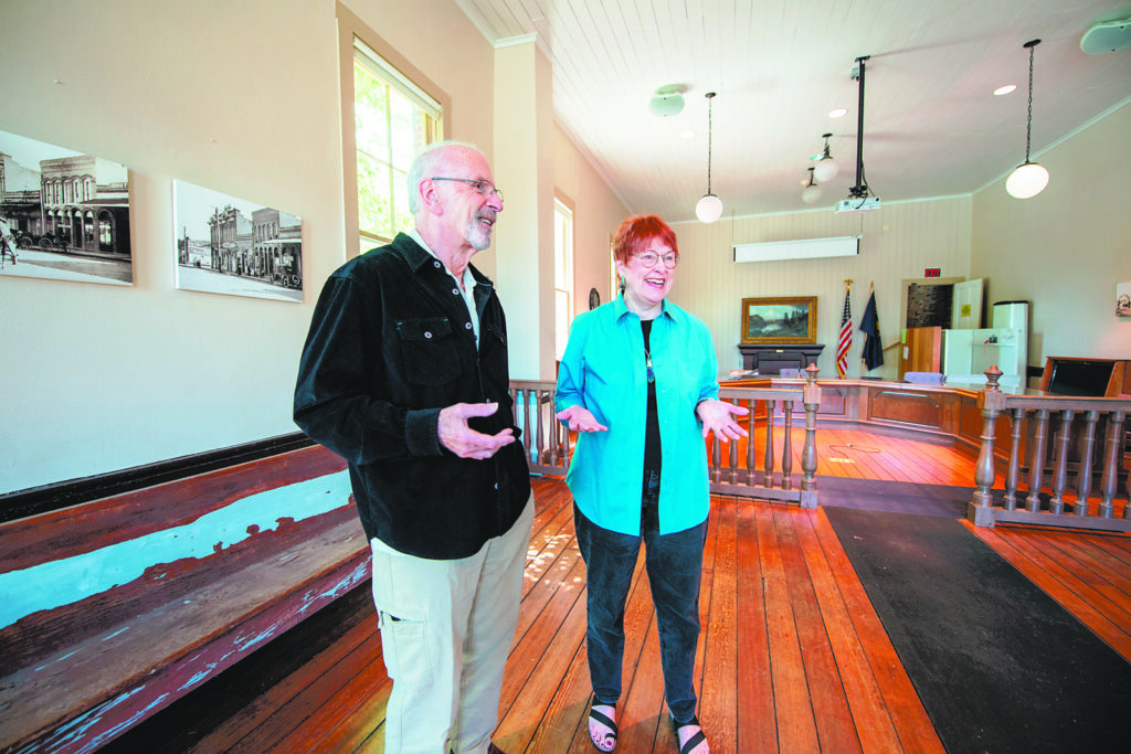 Jacksonville City Councilor Ken Gregg and Carolyn Kingsnorth, president of Historic Jacksonville, show the main room of the Old City Hall, formerly used for city meetings. It is being transformed into a physical anchor for the town’s “Museum without Walls” project as the Jacksonville History Center. Photo: Julie Anderson, Grants Pass Daily Courier.
