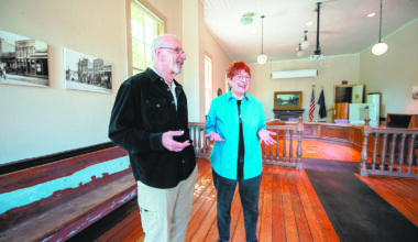 Jacksonville City Councilor Ken Gregg and Carolyn Kingsnorth, president of Historic Jacksonville, show the main room of the Old City Hall, formerly used for city meetings. It is being transformed into a physical anchor for the town’s “Museum without Walls” project as the Jacksonville History Center. Photo: Julie Anderson, Grants Pass Daily Courier.