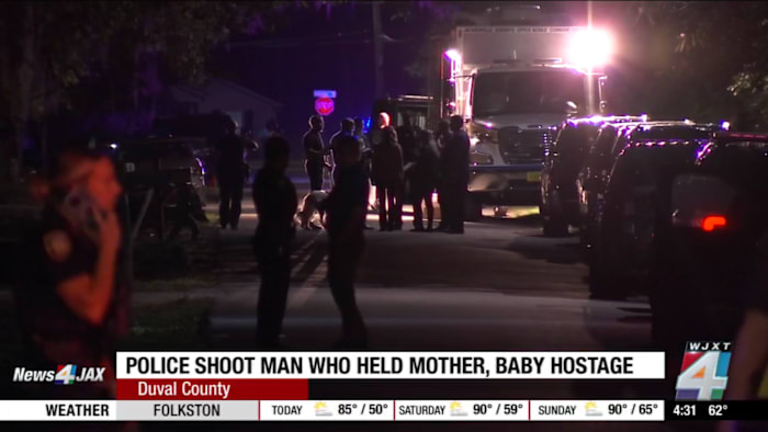 Man shot by officers after alleged hostage situation involving woman, infant, according to JSO