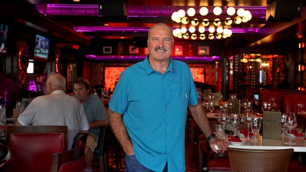 Former Miami Dolphin Kim Bokamper in the dining room of his newest restaurant. The Balcony in Fort Laudedrale, is a two-story restaurant and bar complex that evokes the French Quarter in New Orleans. The Balcony is from ex-Miami Dolphin Kim Bokamper's restaurant group, is stylish and gorgeous and a great place to drink and people-watch but the food is mixed, with some items that are good (andouille sausage appetizer, gumbo) and some that were mediocre (crab cakes, jambalaya, crawfish etoufee). Mike Stocker, South Florida Sun-Sentinel