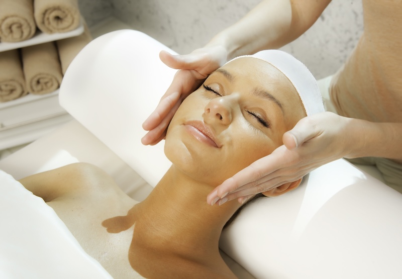 photo of a woman getting a facial at a spa