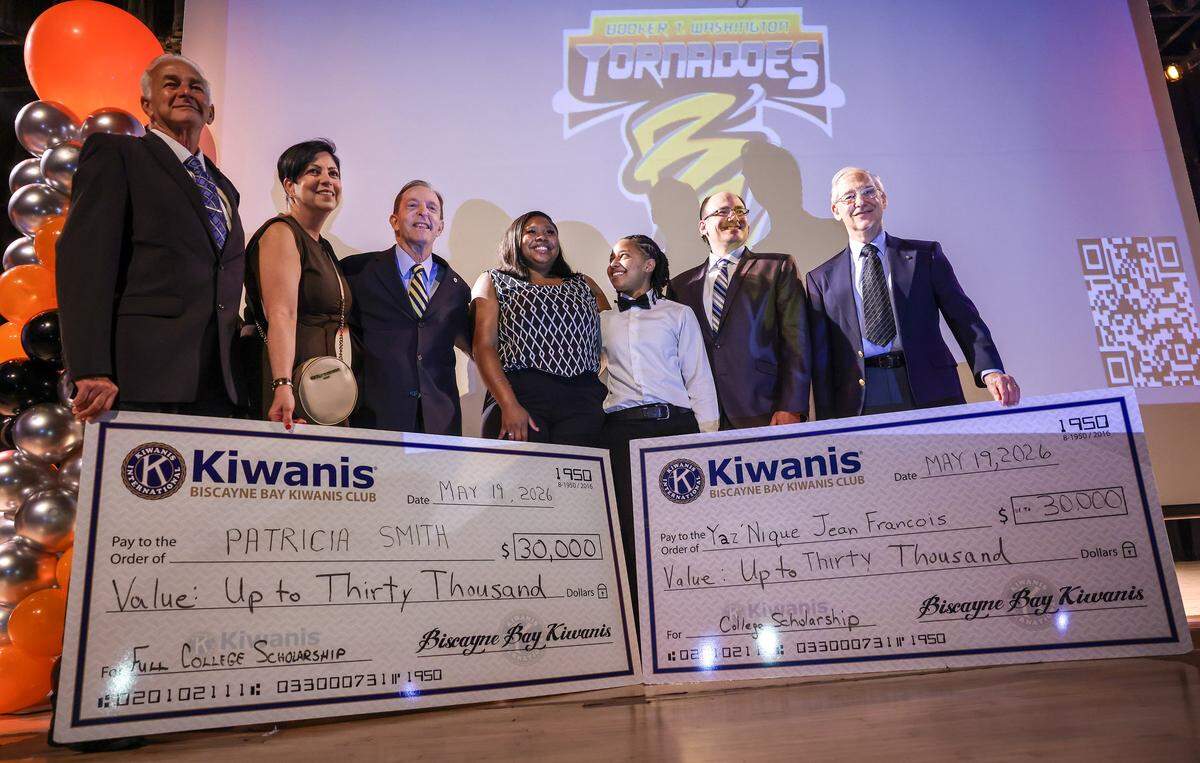 Yaz'Nique Jean Francois, center/right, smiles towards Patricia Smith, center/left, after both were awarded scholarships during the Booker T. Washington Senior High School Class of 2026 Senior Awards Ceremony on Tuesday, May 19, 2026, in Miami, Florida.