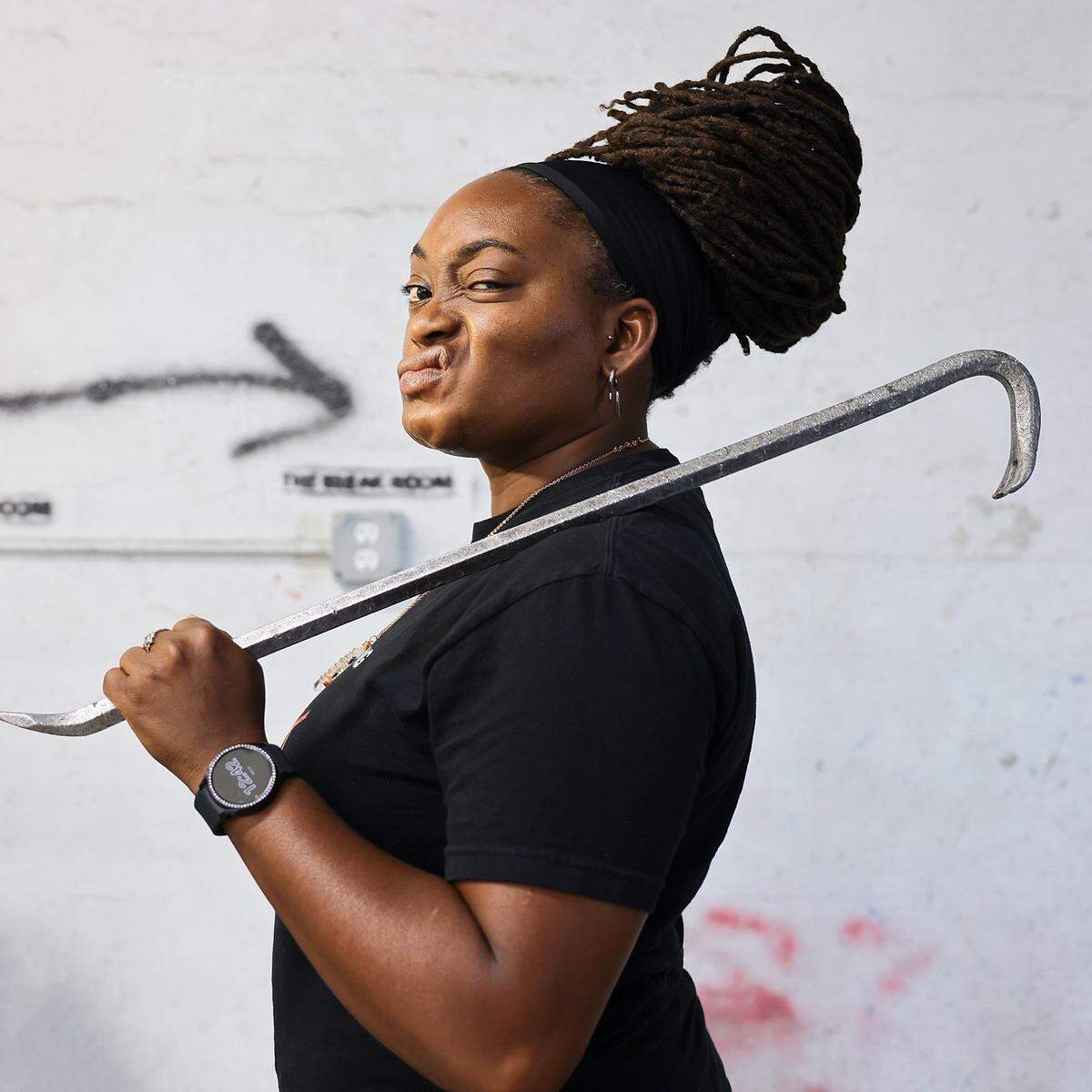 Christina Brown, 40, owner of Break Room Miami, holds one of many implements of destruction used inside the rage rooms on Thursday, May 7, 2026, in Miami.