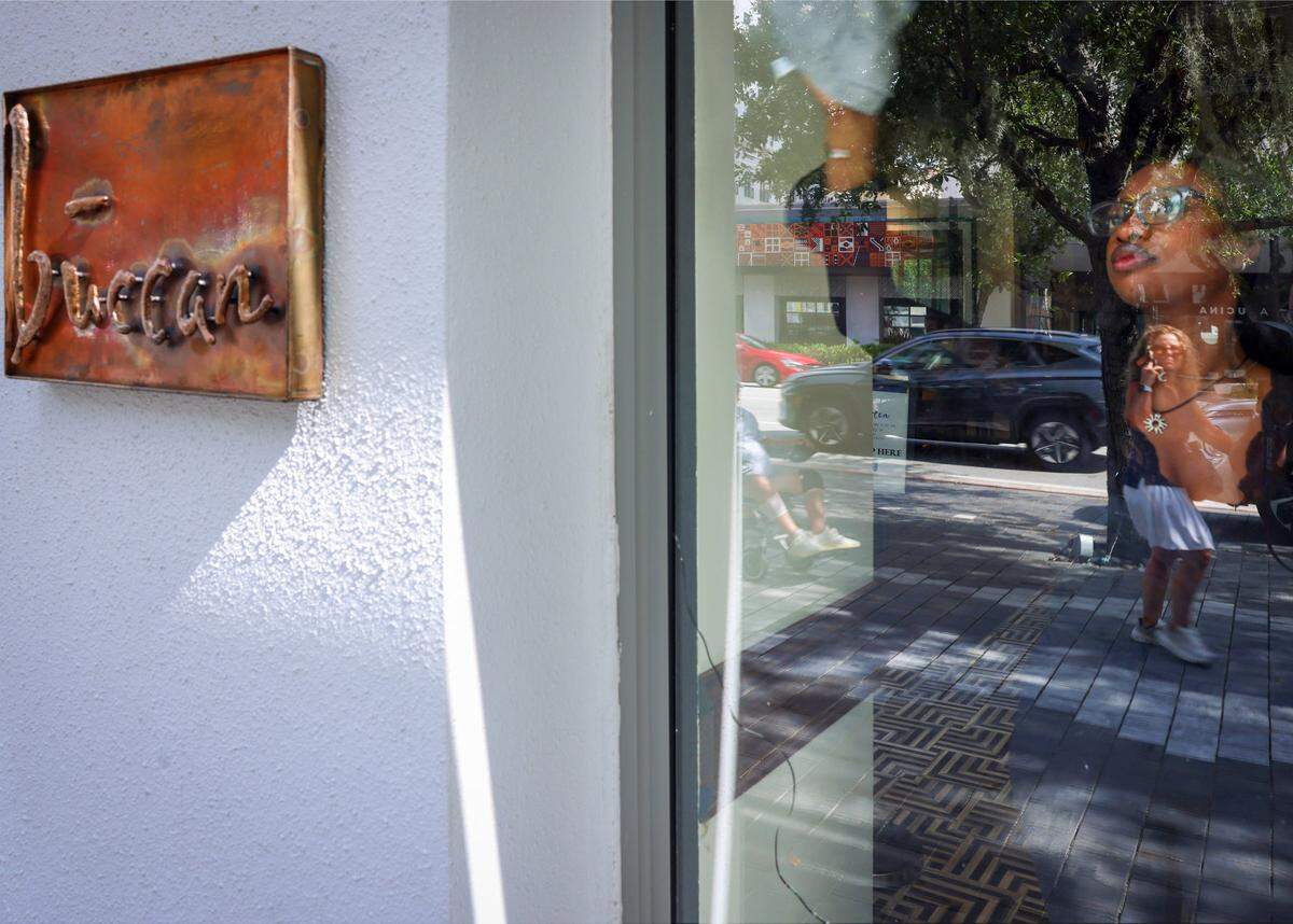 Buccan staffers clean the windows and doors as they prepare for “friends and family” opening at the new restaurant in Coral Gables, ahead of its official opening on Tuesday, May 19, 2026.